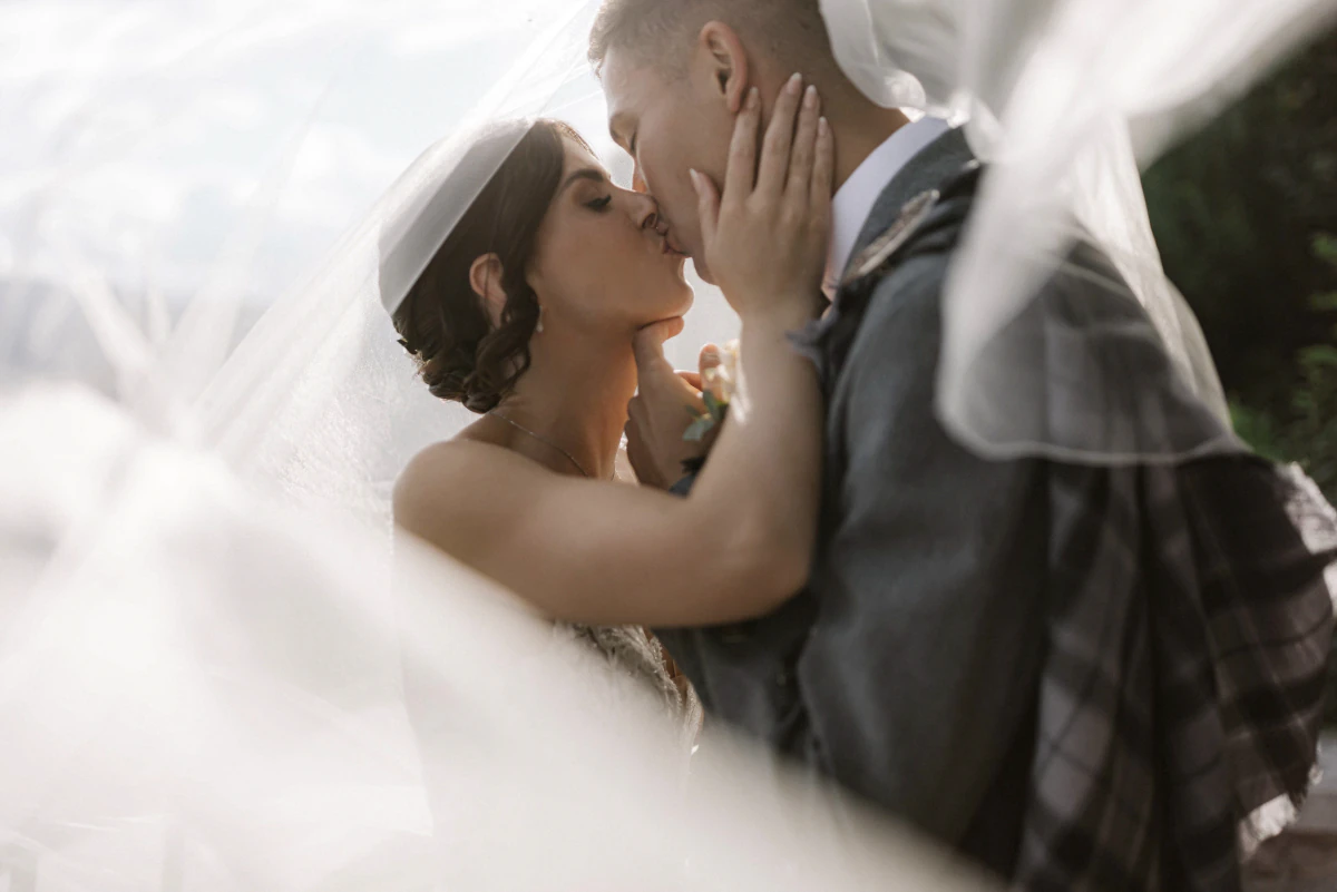Bride and groom beneath the veil