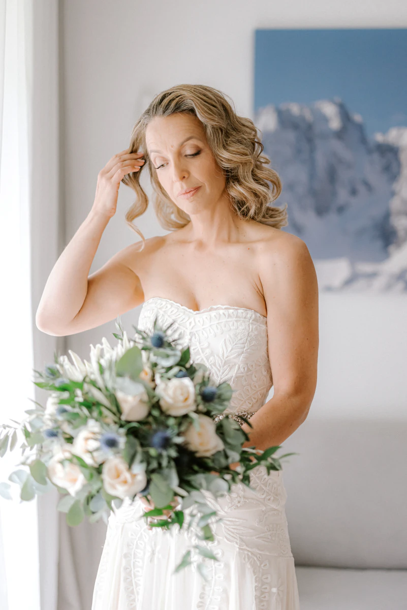 Bride with her bouquet in the mountains
