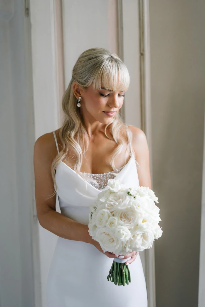 Bride with her bouquet on the wedding morning