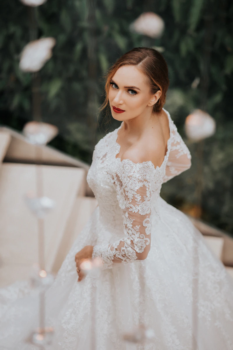 Bride in a lace gown in the garden