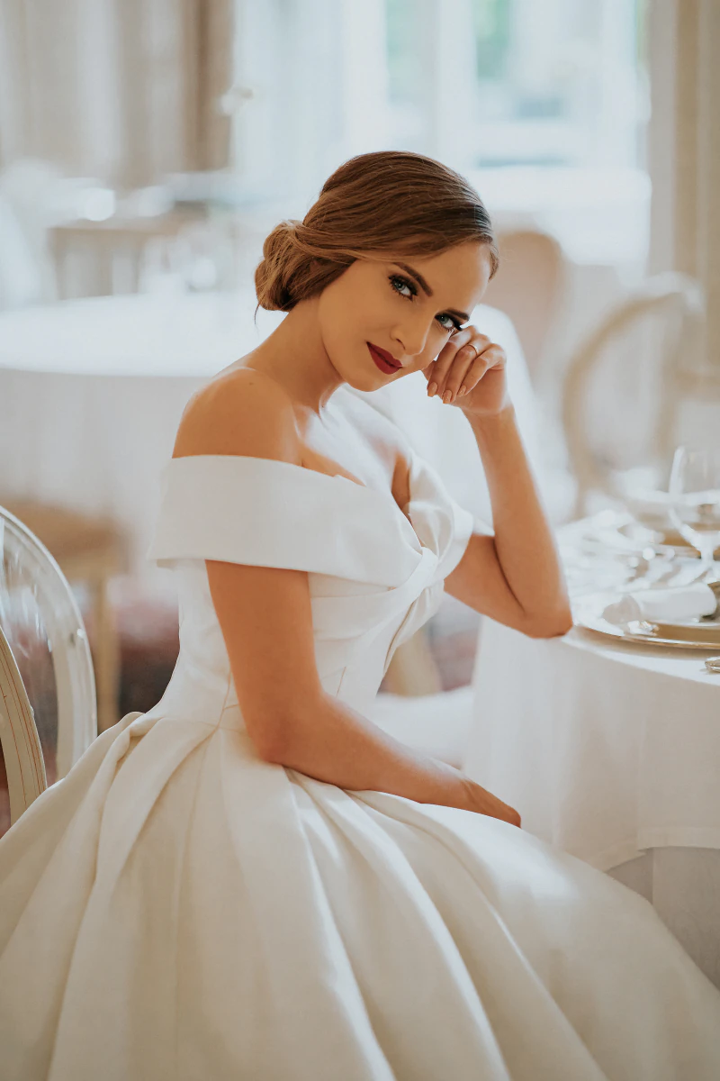 Bride with an updo in a satin gown