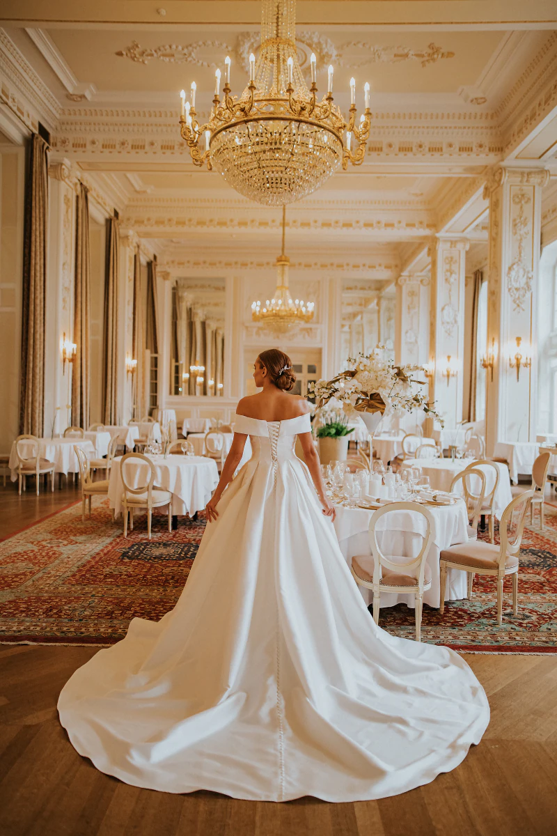 Bride in the wedding hall, photographed from behind