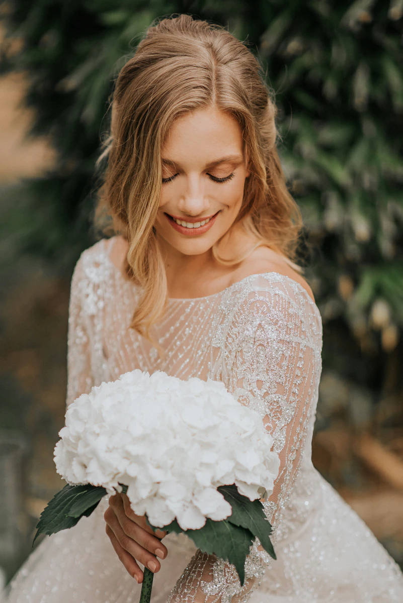 Bride with a white bouquet
